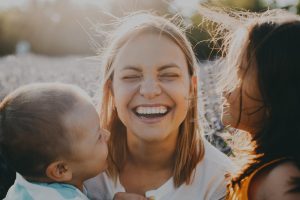 Mother smiling with kids